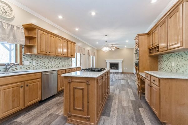 Chandelier, Fireplace, Interior, Kitchen, Recessed Lighting, Wood Texture Flooring