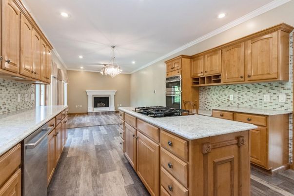 Chandelier, Fireplace, Interior, Kitchen, Pendant Lights, Recessed Lighting, Stainless Steel Appliances, Wood Texture Flooring