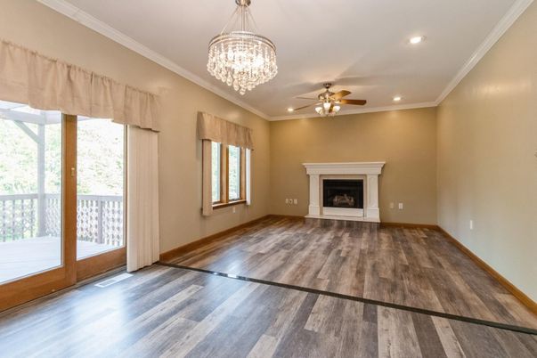 Chandelier, Empty room, Fireplace, Interior, Recessed Lighting, Wood Texture Flooring