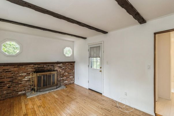 Empty room, Fireplace, Interior, Stone Walls, Wooden Beams, Wood Texture Flooring