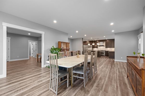 Dining room, Interior, Kitchen, Pendant Lights, Recessed Lighting, Stainless Steel Appliances, Wood Texture Flooring