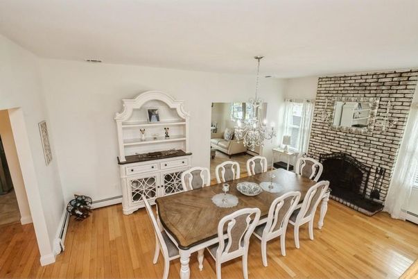 Chandelier, Dining room, Fireplace, Interior, Stone Walls, Wood Texture Flooring