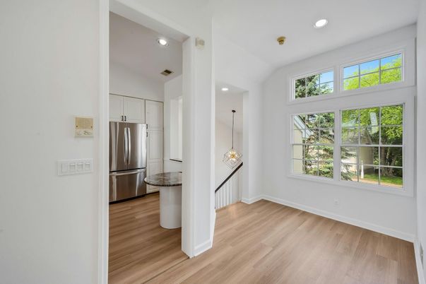 Empty room, Interior, Kitchen, Pendant Lights, Recessed Lighting, Stainless Steel Appliances, Wood Texture Flooring