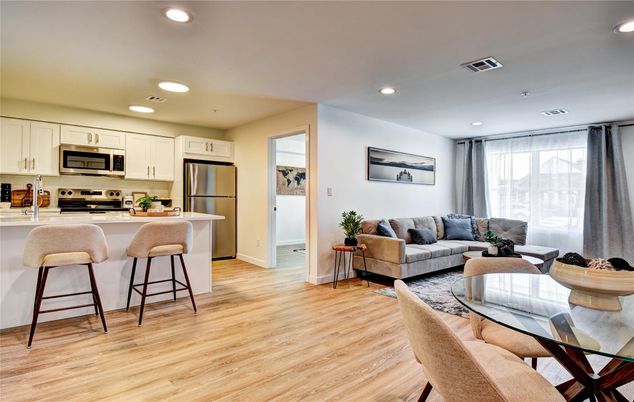Dining room, Interior, Kitchen, Living room, Recessed Lighting, Stainless Steel Appliances, Wood Texture Flooring