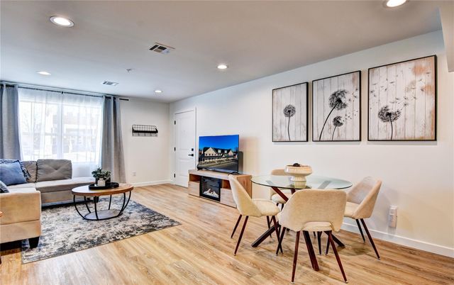 Dining room, Fireplace, Interior, Living room, Recessed Lighting, Wood Texture Flooring