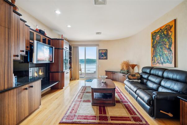 Fireplace, Interior, Living room, Recessed Lighting, Water, Wood Texture Flooring