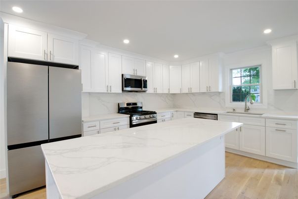 Interior, Kitchen, Marble Walls, Recessed Lighting, Stainless Steel Appliances, Wood Texture Flooring