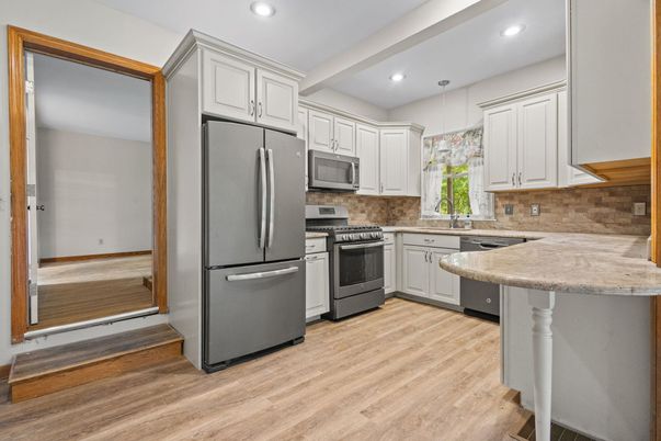 Interior, Kitchen, Pendant Lights, Recessed Lighting, Stainless Steel Appliances, Wood Texture Flooring
