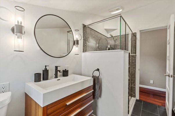 Bathroom, Dual Sink Vanities, Glass Shower, Interior, Wood Texture Flooring