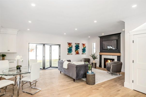 Dining room, Fireplace, Interior, Living room, Recessed Lighting, Wood Texture Flooring