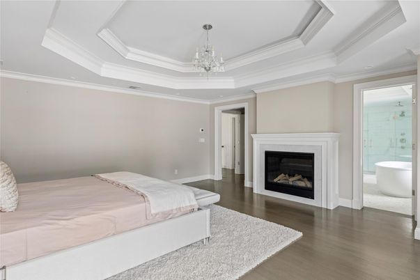 Bedroom, Chandelier, Fireplace, Interior, Recessed Lighting, Wood Texture Flooring