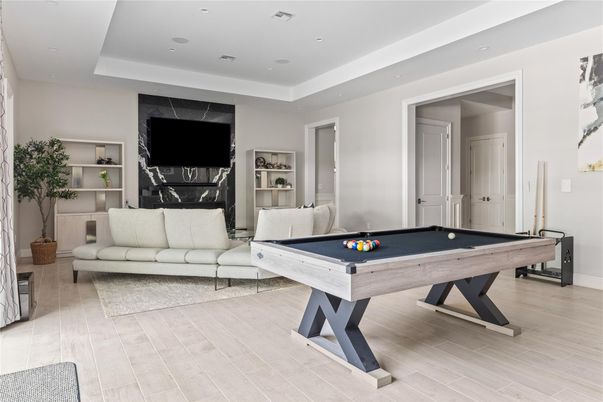 Billiard Table, Fireplace, Game Room, Interior, Living room, Recessed Lighting, Wood Texture Flooring