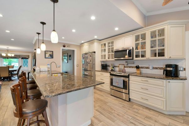 Chandelier, Dining room, Interior, Kitchen, Pendant Lights, Recessed Lighting, Stainless Steel Appliances, Wood Texture Flooring