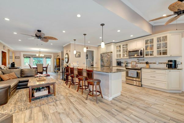 Chandelier, Dining room, Interior, Kitchen, Living room, Pendant Lights, Recessed Lighting, Stainless Steel Appliances, Wood Texture Flooring