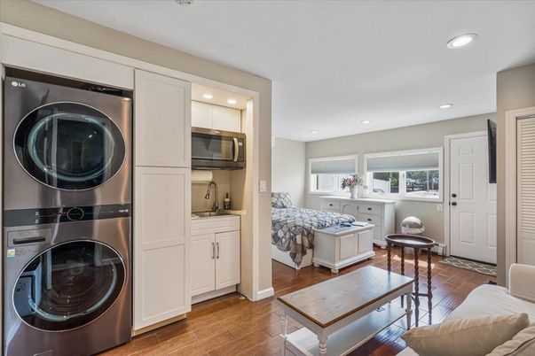 Bedroom, Interior, Recessed Lighting, Utility Closets, Washer, Wood Texture Flooring