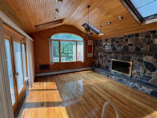 Chandelier, Empty room, Fireplace, Interior, Pendant Lights, Recessed Lighting, Stone Walls, Wooden Ceilings, Wood Texture Flooring, Wooden Walls