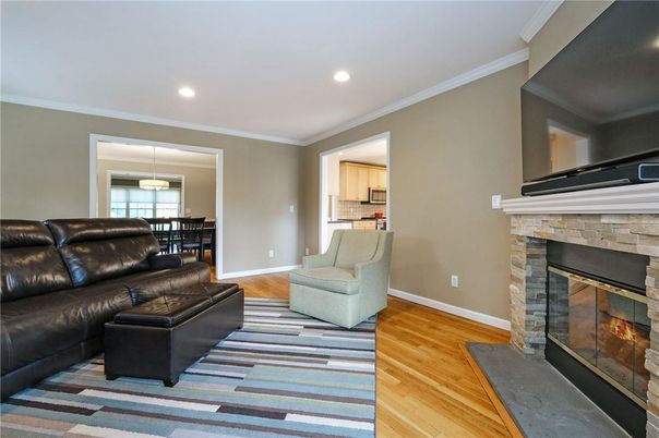 Dining room, Fireplace, Interior, Living room, Pendant Lights, Recessed Lighting, Wood Texture Flooring