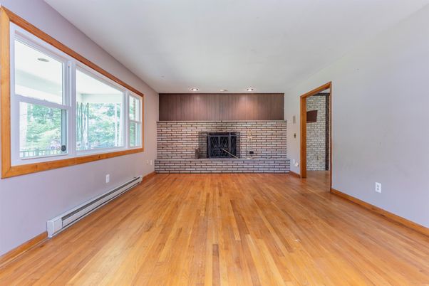 Empty room, Fireplace, Interior, Recessed Lighting, Stone Walls, Wood Texture Flooring