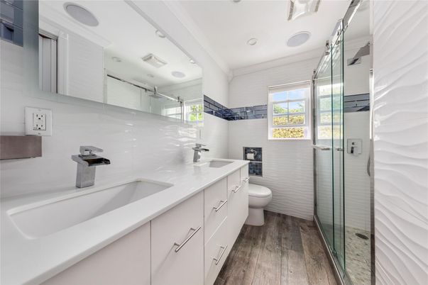 Bathroom, Dual Sink Vanities, Glass Shower, Interior, Recessed Lighting, Wood Texture Flooring