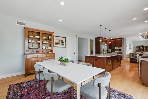 Dining room, Interior, Kitchen, Pendant Lights, Recessed Lighting, Stainless Steel Appliances, Wood Texture Flooring