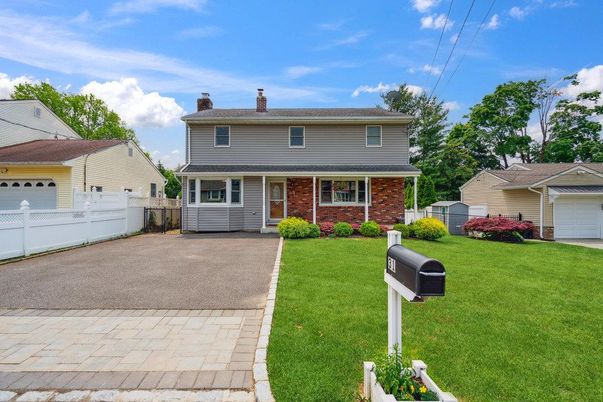 Attached, Backyard, Exterior, Facade, Brick Facade, Split Level