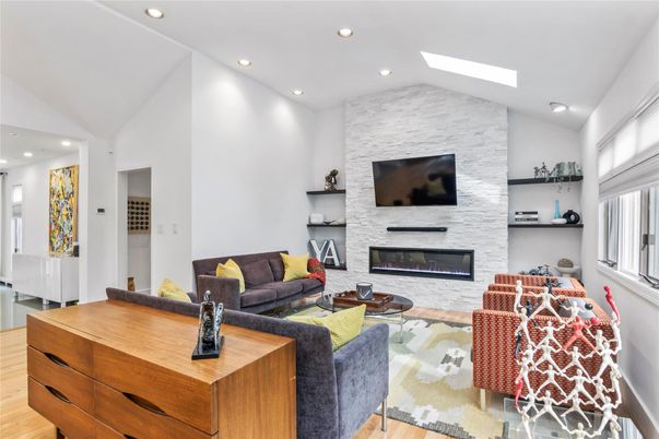 Fireplace, Interior, Living room, Recessed Lighting, Stone Walls, Wood Texture Flooring