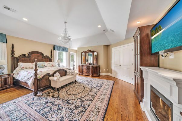 Bedroom, Chandelier, Fireplace, Interior, Recessed Lighting, Wood Texture Flooring