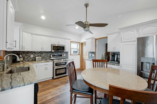 Dining room, Interior, Kitchen, Recessed Lighting, Stainless Steel Appliances, Wood Texture Flooring