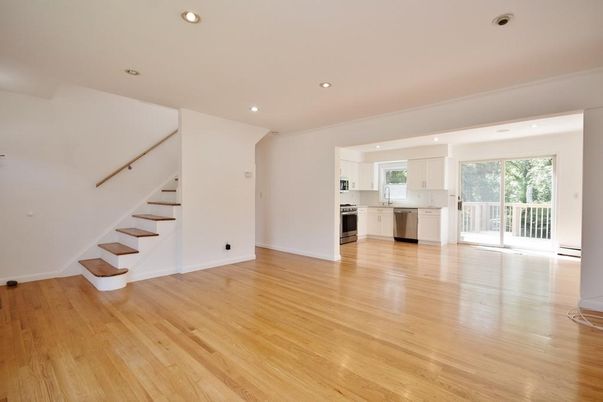 Empty room, Interior, Kitchen, Recessed Lighting, Stainless Steel Appliances, Wood Texture Flooring