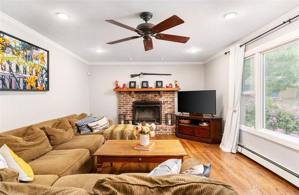 Fireplace, Interior, Living room, Recessed Lighting, Stone Walls, Wood Texture Flooring
