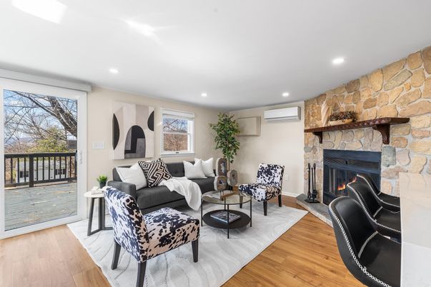 Fireplace, Interior, Living room, Recessed Lighting, Stone Walls, Wood Texture Flooring