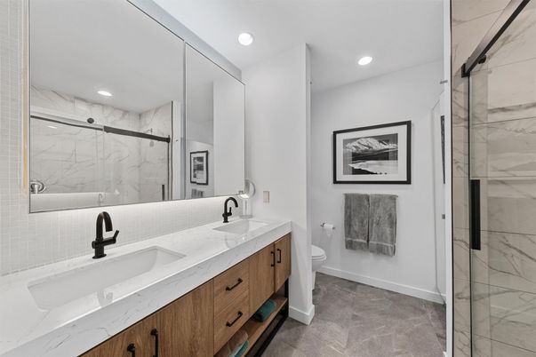 Bathroom, Dual Sink Vanities, Glass Shower, Interior, Marble Walls, Recessed Lighting