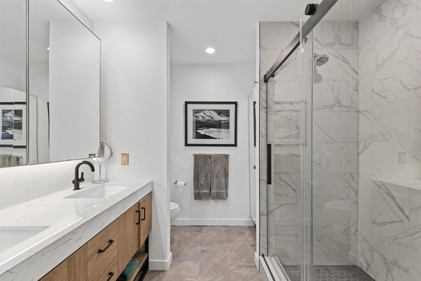 Bathroom, Dual Sink Vanities, Glass Shower, Interior, Marble Walls, Recessed Lighting