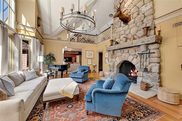 Chandelier, Fireplace, Interior, Living room, Piano, Stone Walls, Wood Texture Flooring