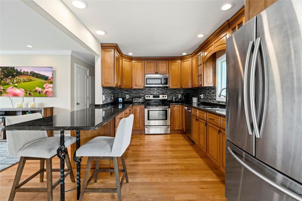 Dining room, Interior, Kitchen, Recessed Lighting, Stainless Steel Appliances, Wood Texture Flooring