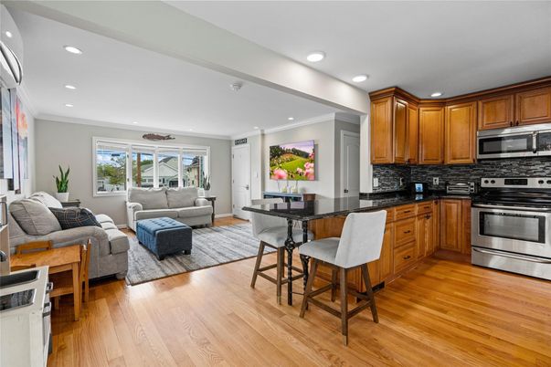 Dining room, Interior, Kitchen, Living room, Recessed Lighting, Stainless Steel Appliances, Wood Texture Flooring