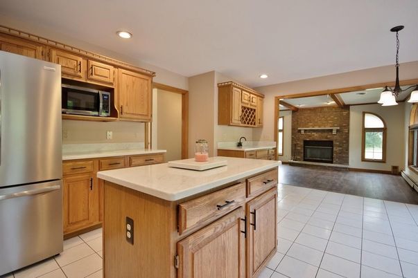 Fireplace, Interior, Kitchen, Pendant Lights, Recessed Lighting, Stainless Steel Appliances, Stone Walls