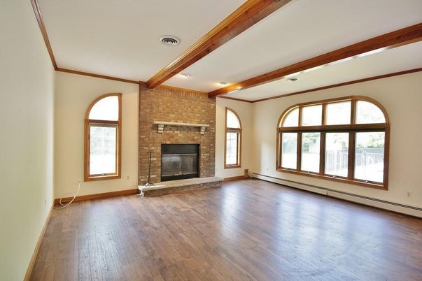 Empty room, Fireplace, Interior, Recessed Lighting, Stone Walls, Wooden Beams, Wood Texture Flooring