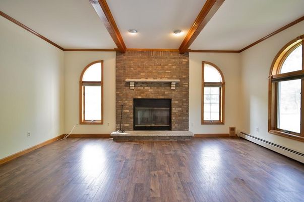 Empty room, Fireplace, Interior, Recessed Lighting, Stone Walls, Wooden Beams, Wood Texture Flooring