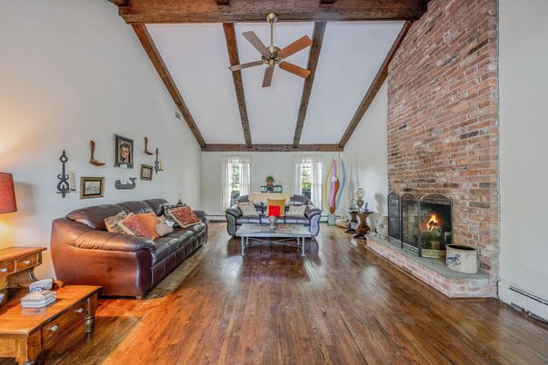 Dining room, Fireplace, Interior, Living room, Stone Walls, Wooden Beams, Wood Texture Flooring