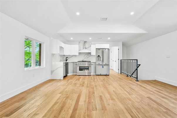 Interior, Kitchen, Marble Walls, Recessed Lighting, Stainless Steel Appliances, Wood Texture Flooring