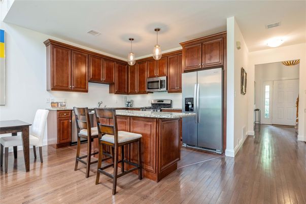 Dining room, Interior, Kitchen, Pendant Lights, Stainless Steel Appliances, Wood Texture Flooring