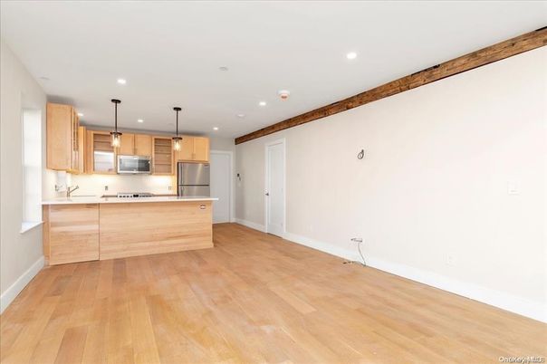 Empty room, Interior, Kitchen, Pendant Lights, Recessed Lighting, Stainless Steel Appliances, Wood Texture Flooring
