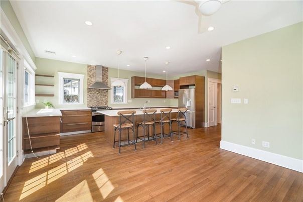 Interior, Kitchen, Pendant Lights, Recessed Lighting, Stainless Steel Appliances, Stone Walls, Wood Texture Flooring