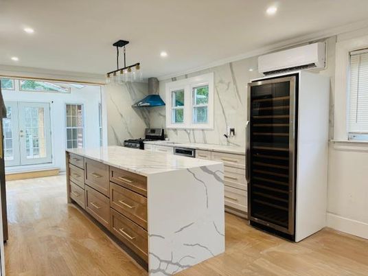Interior, Kitchen, Marble Walls, Pendant Lights, Recessed Lighting, Stainless Steel Appliances, Wood Texture Flooring