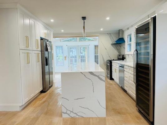 Interior, Kitchen, Marble Walls, Pendant Lights, Recessed Lighting, Stainless Steel Appliances, Wood Texture Flooring