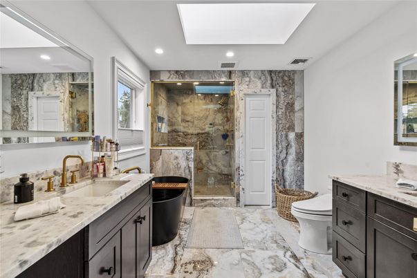 Bathroom, Dual Sink Vanities, Glass Shower, Interior, Marble, Marble Walls, Recessed Lighting