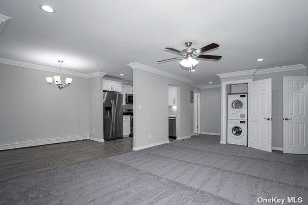 Chandelier, Empty room, Interior, Kitchen, Recessed Lighting, Stainless Steel Appliances, Wood Texture Flooring
