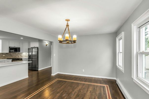 Empty room, Interior, Kitchen, Pendant Lights, Stainless Steel Appliances, Wood Texture Flooring