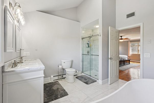 Bathroom, Dual Sink Vanities, Glass Shower, Interior, Recessed Lighting, Wood Texture Flooring